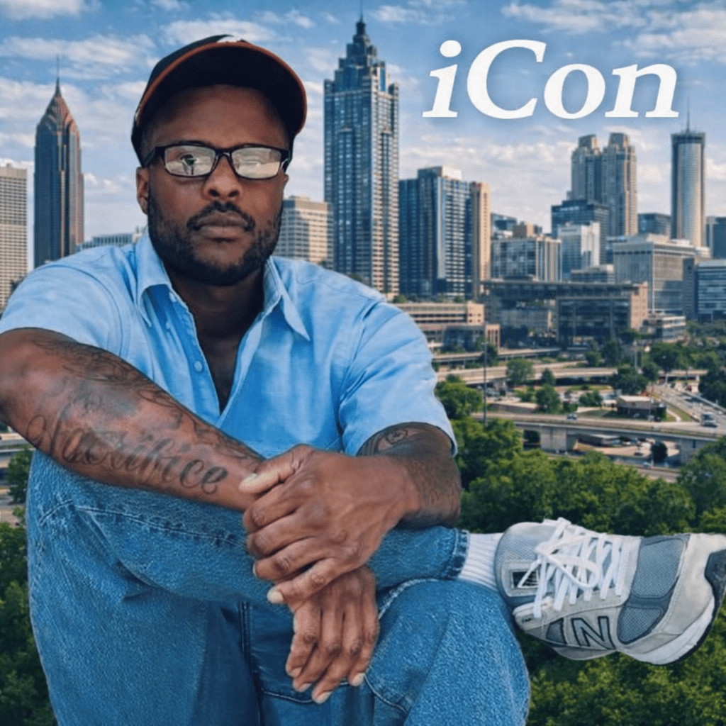Man with tattoos sits confidently in front of a skyline
